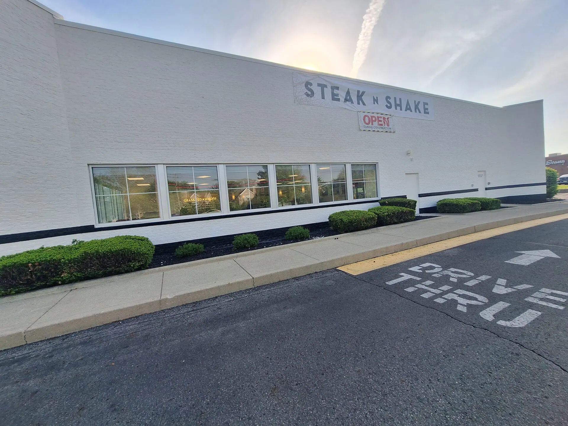 Steak 'n Shake commercial exterior repaint — drive-thru side wall after fresh coat