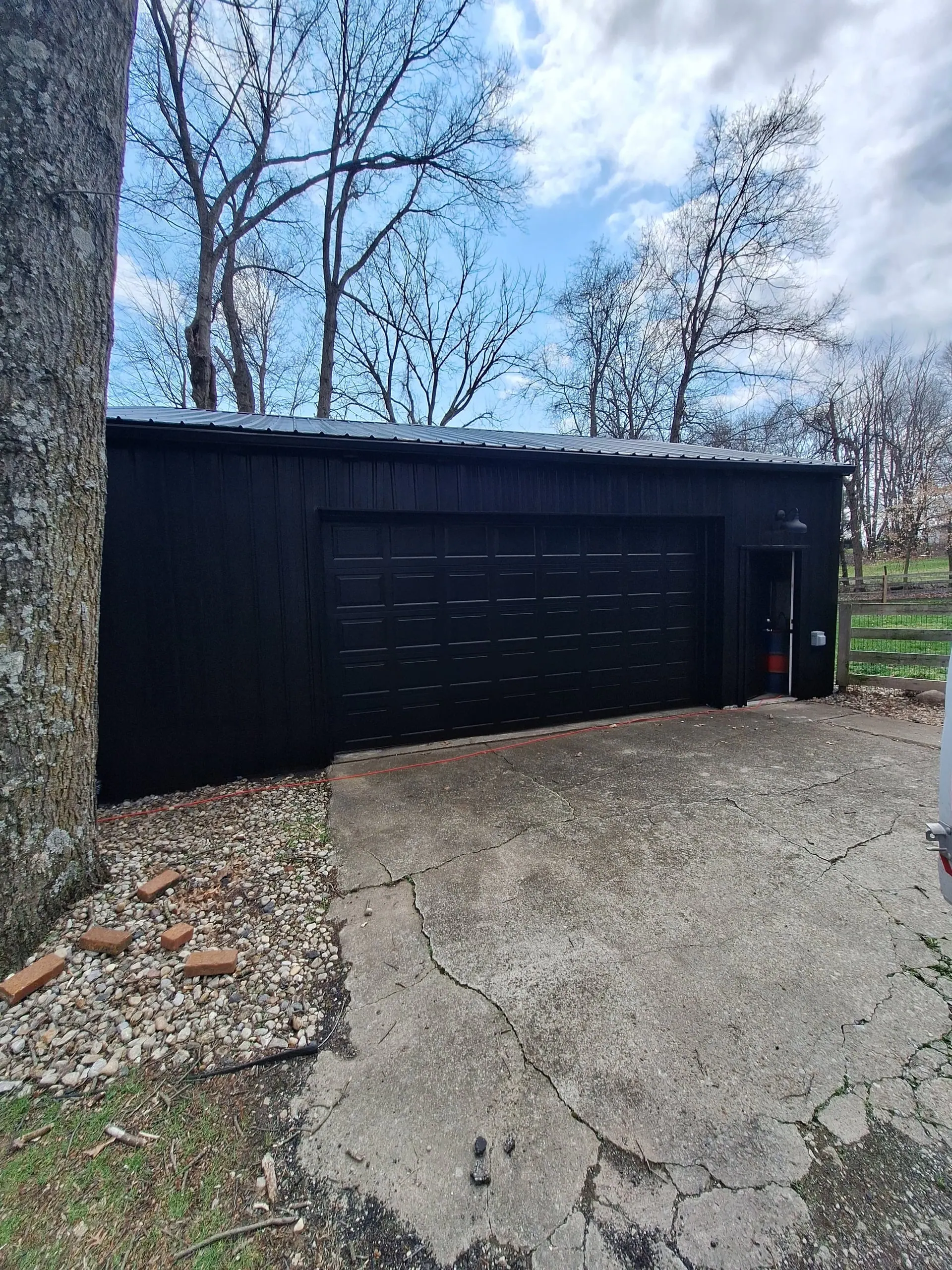 Garage exterior painted black with clean finish