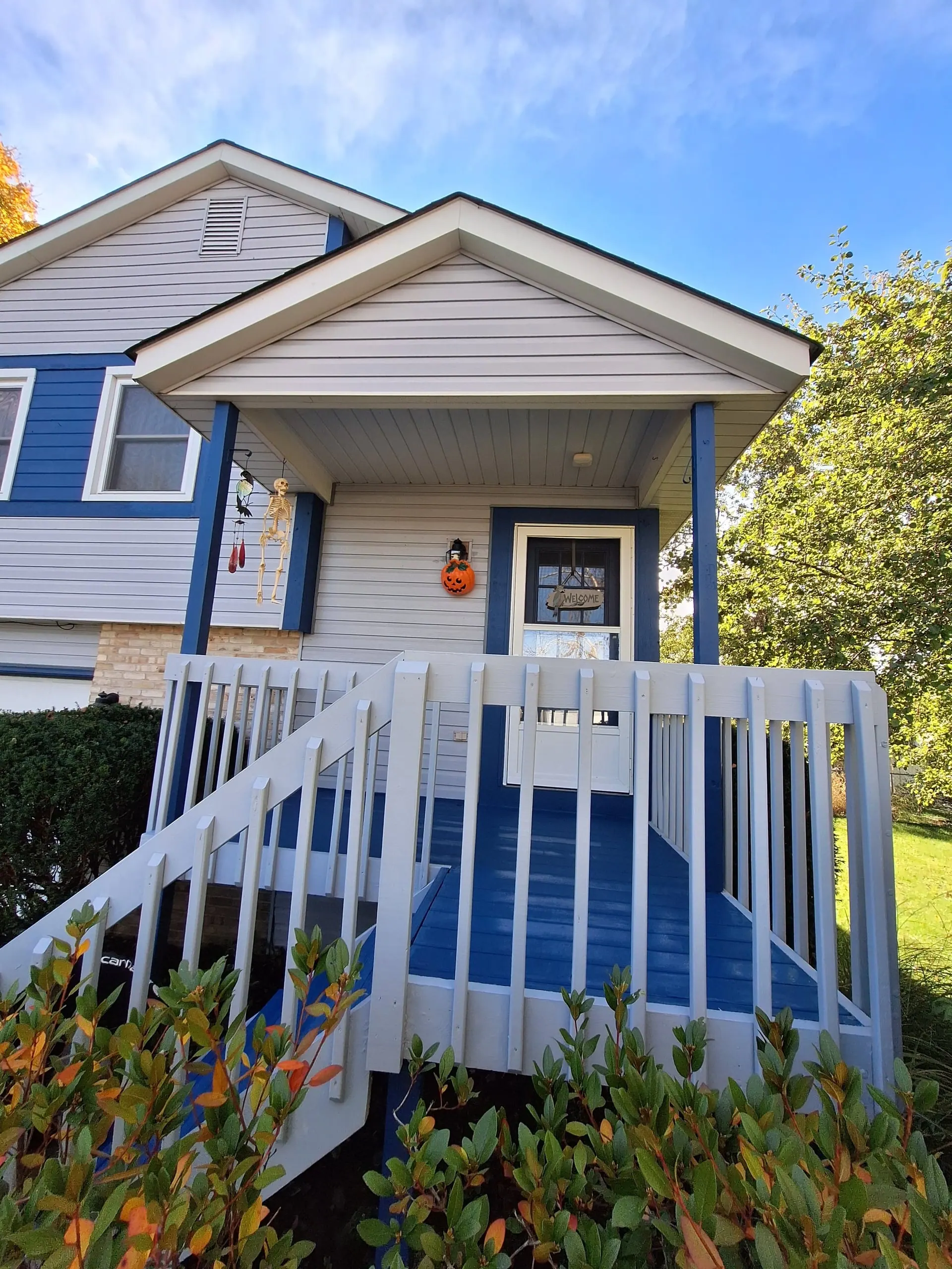 Exterior painting with blue accent on porch in Central Ohio