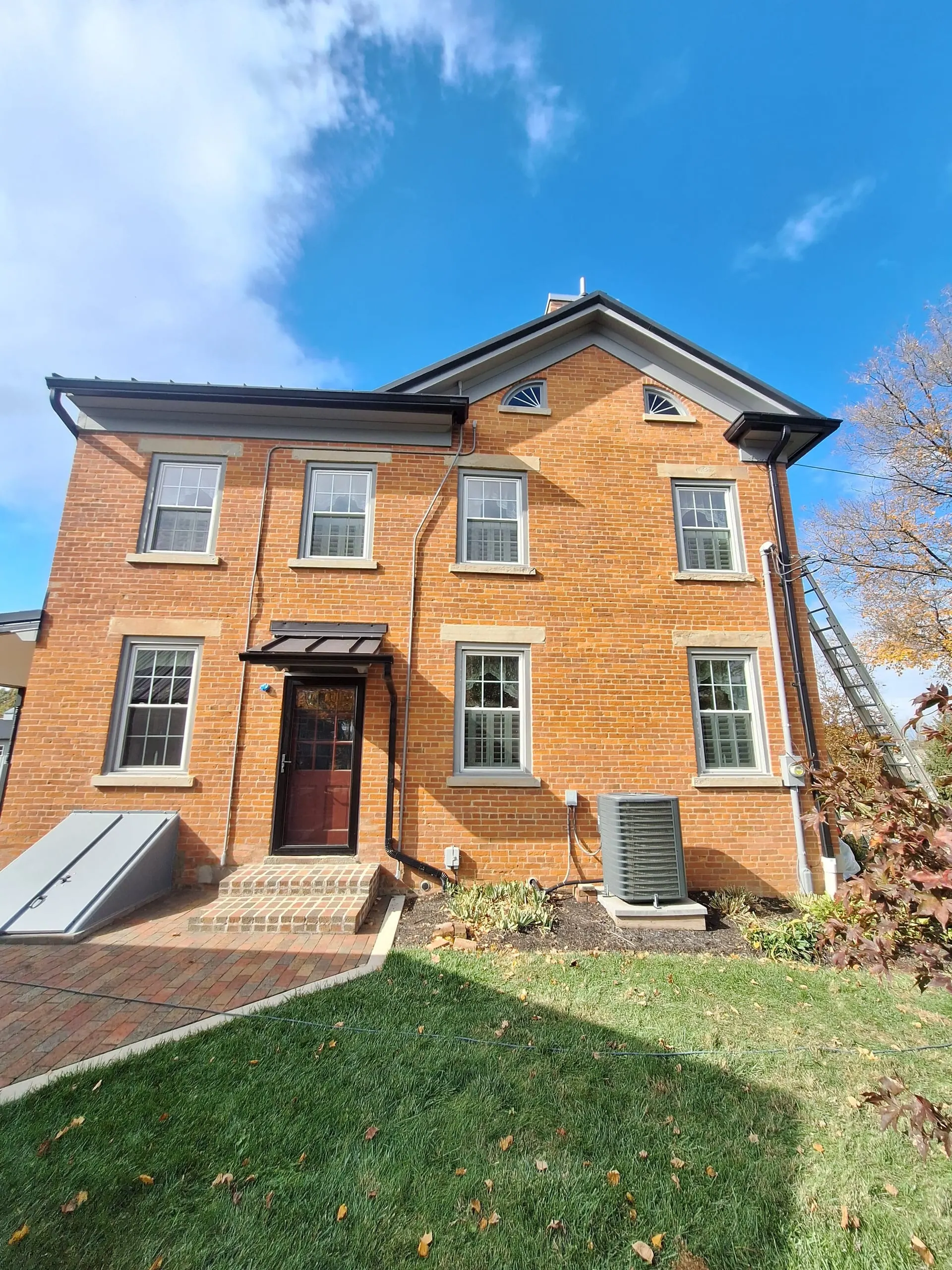 Masonry painting on historic brick home in Central Ohio