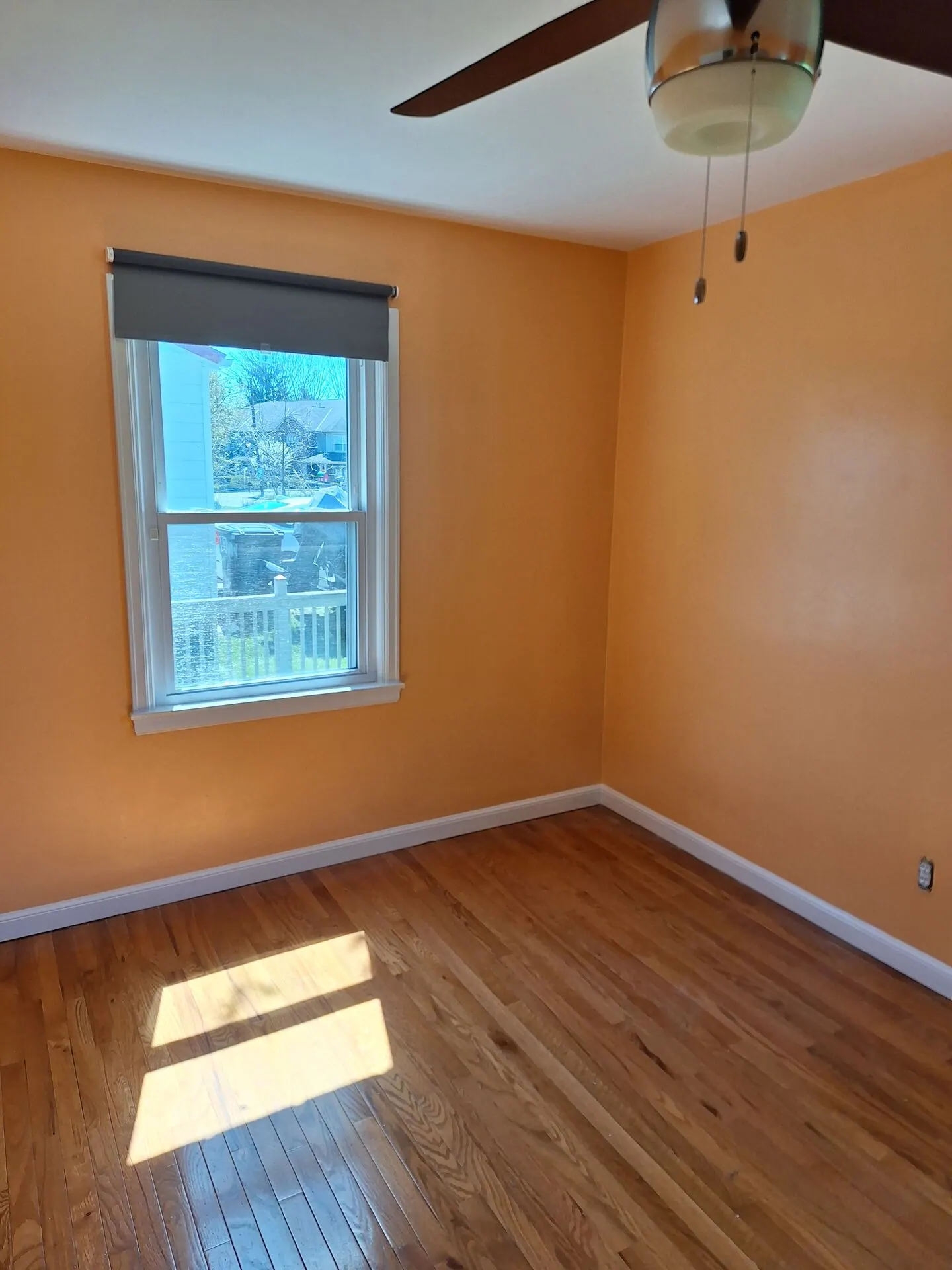 Room painted warm apricot with white trim