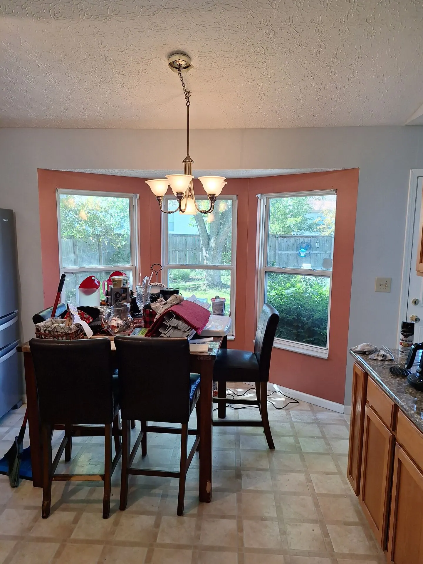 Breakfast nook bay window with coral accent walls