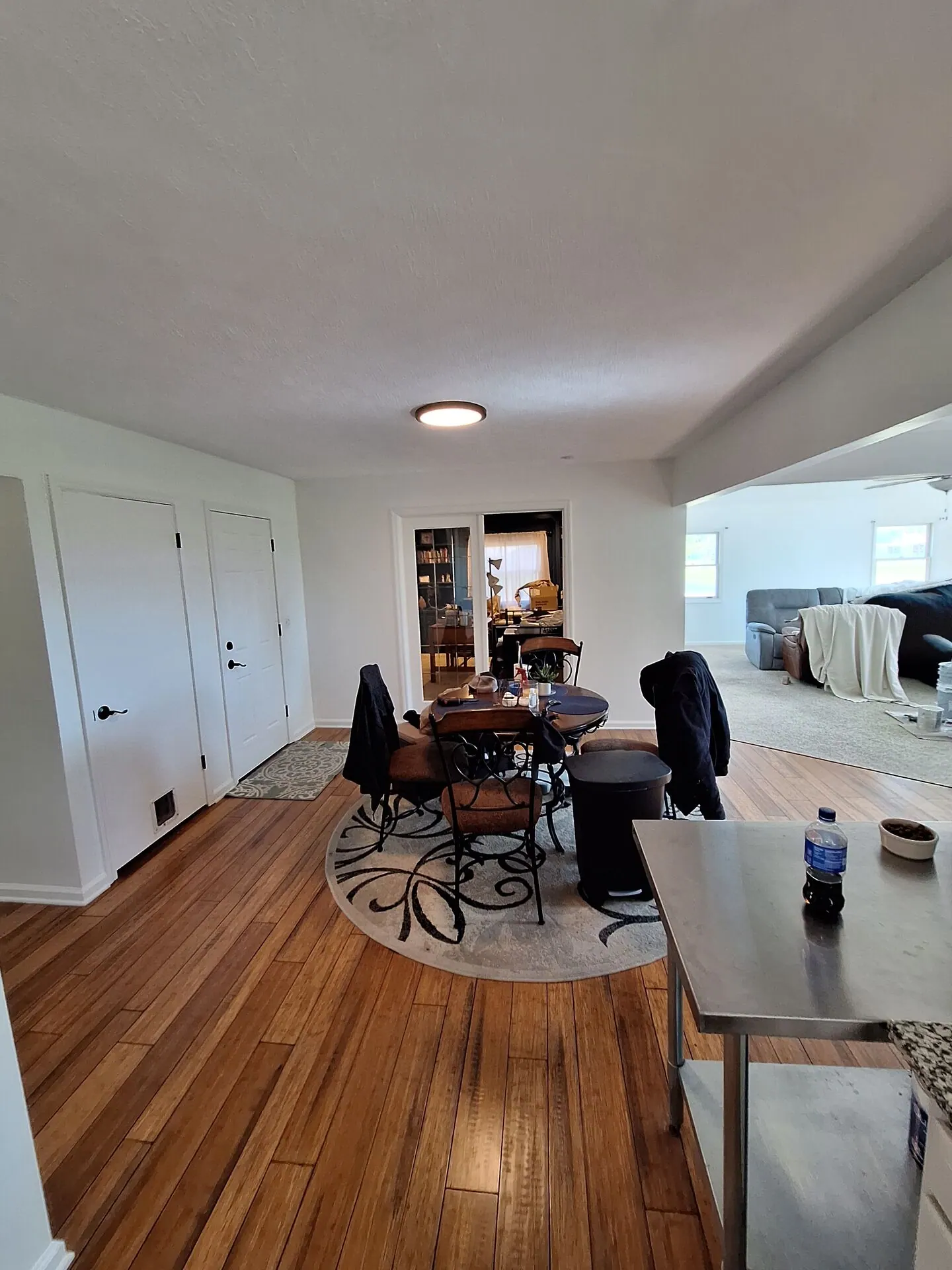Dining area and living room painted white
