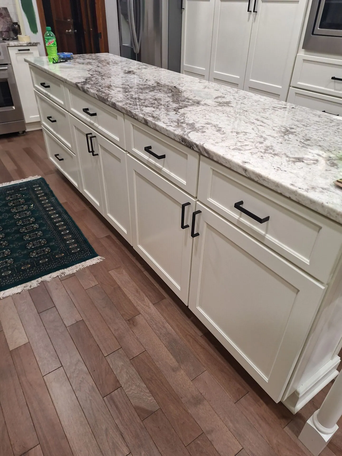 Kitchen island with cabinets painted creamy white