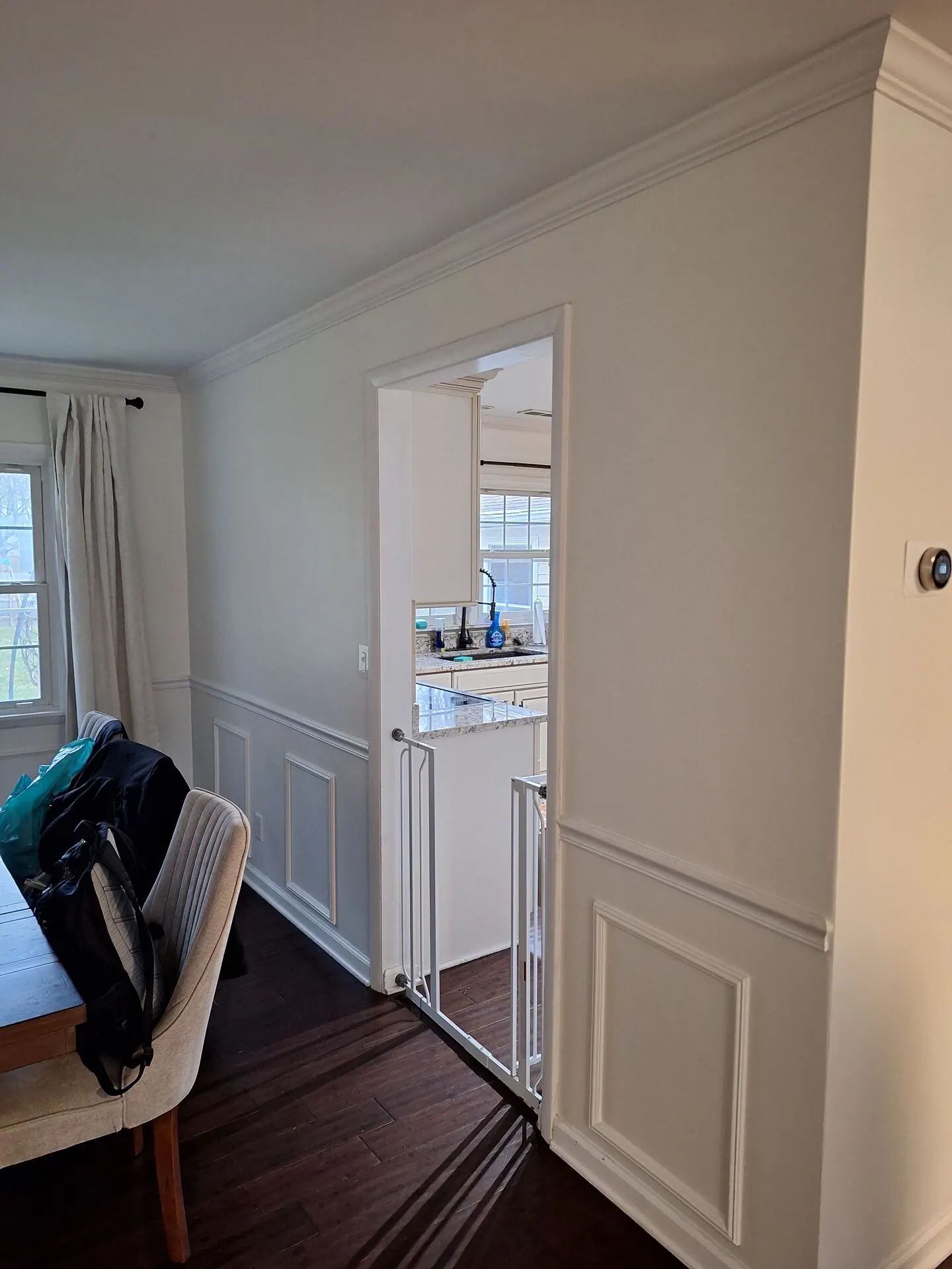 Dining room with fresh white walls and wainscoting